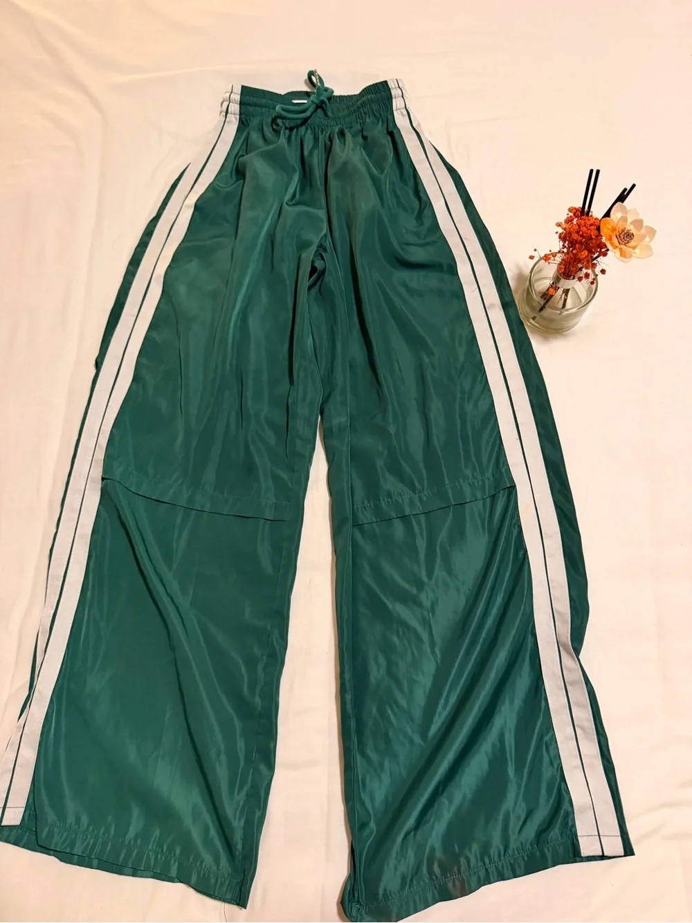 Edikted Emerald Green Track Pants with White Tag Accent